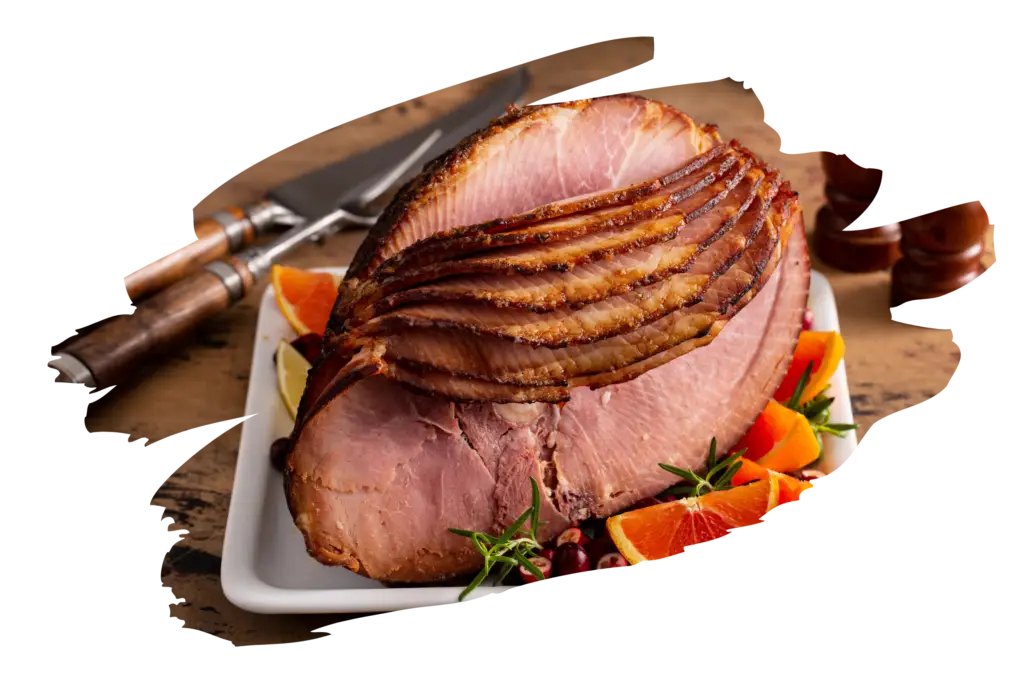 Glazed spiral-cut Easter ham, showcasing the perfect result of traditional Easter ham recipes, presented on a white platter with orange slices and fresh herbs as garnish.