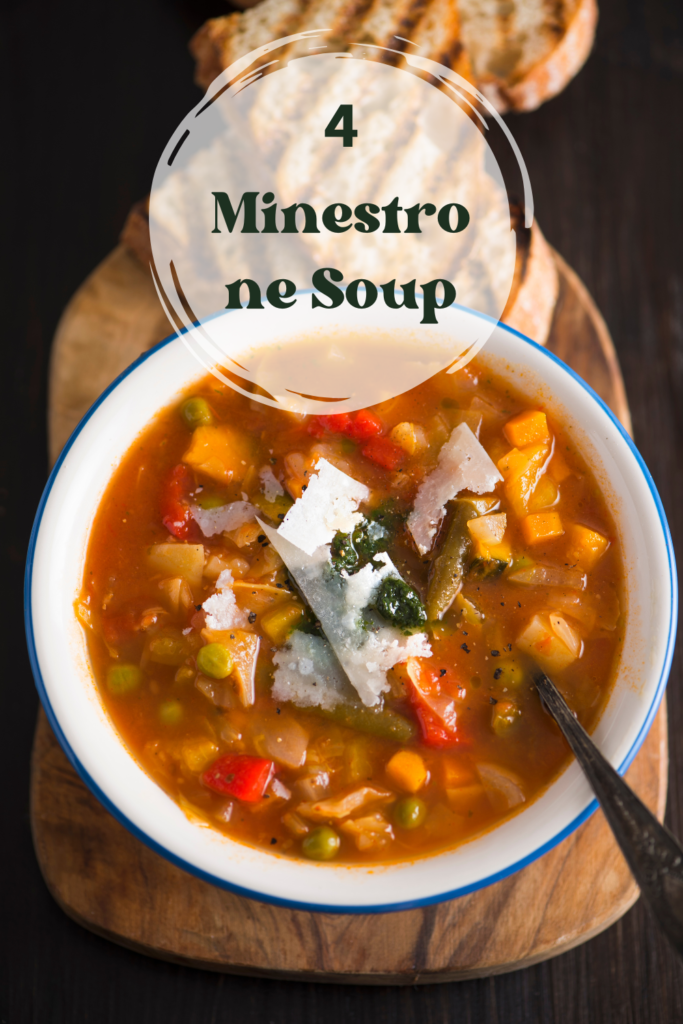 A steaming bowl of classic minestrone soup topped with Parmesan cheese and fresh herbs.