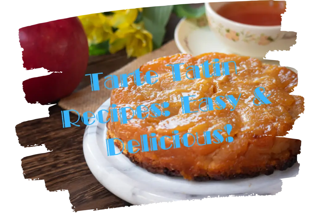 A beautifully caramelized apple tarte tatin on a white plate surrounded by fresh red and yellow apples on a rustic wooden table with a gray cloth.